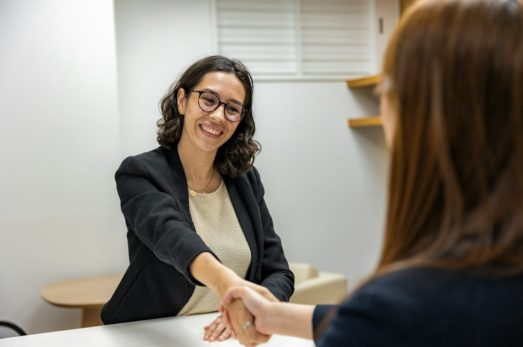 business handshake in office